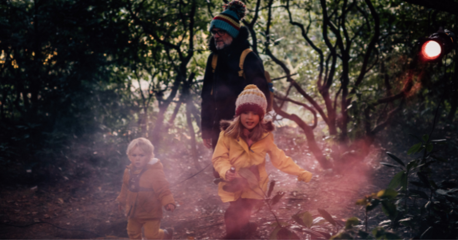 Family walking through the Halloween Illuminated trail at Ushaw, Historic House, Chapels and Gardens